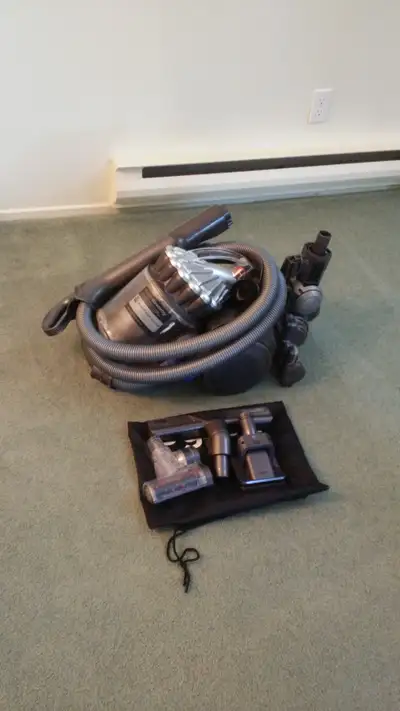 This is a used Dyson DC23 vacuum cleaner, designed for powerful cleaning and easy maneuverability. I...