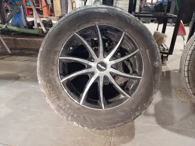 4 rims off CRV new condition with center caps and lug nuts. 4 tires 225/65-17 in good condition. 4 r...