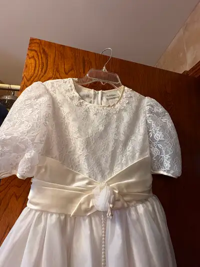 First Communion dress. Only worn once for a few hours. Tag says Size 14 but fits smaller. Worn for G...