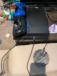 PS4 with 23 games and 2 controllers