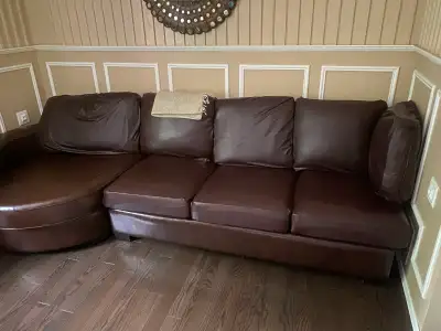 A large L shaped leather couch , View more