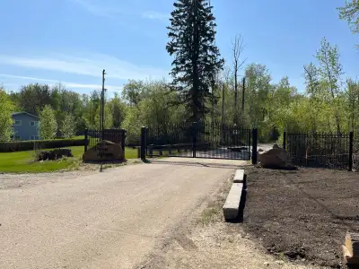 Treed lakefront building site at Wabamun. Older cabin (no value) and oversized double detached garag...