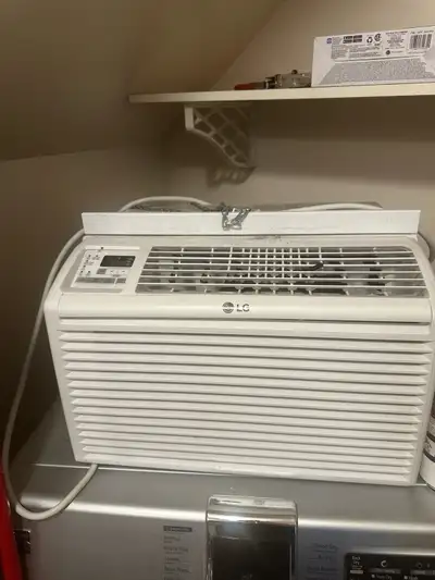 This is a used LG air conditioner with 6000 BTU, model number LW6017R, perfect for cooling a small t...