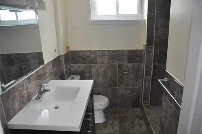 Bright, spacious and furnished room available in walk out basement seperate enterance behind Albion...