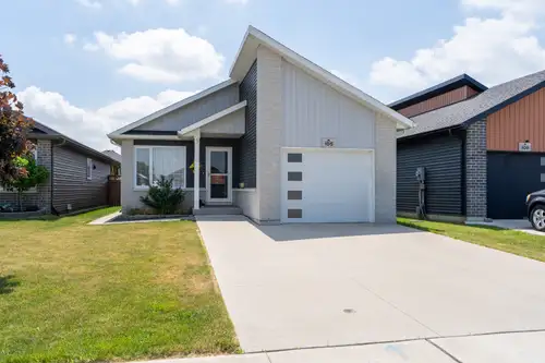Step into a home that instantly lifts your spirits — a bright, feel-good bungalow built in 2020 that...
