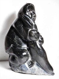 soapstone carving Hunter Holding Seal possibly by Thomas Sivuraq