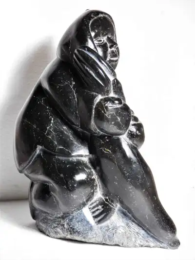 soapstone carving Hunter Holding Seal possibly by Thomas Sivuraq, View more