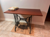 Table with antique Singer sewing machine base