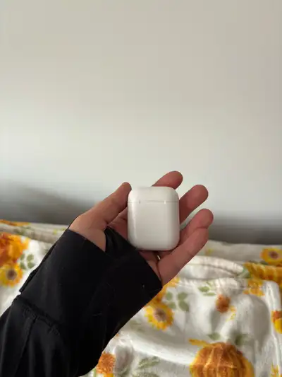 AirPods in case, View more