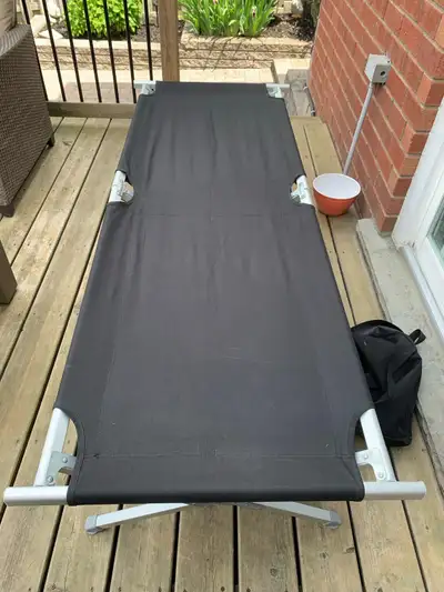 Like new sleeping cots. These can be used for camping to keep you off the ground or for when you hav...
