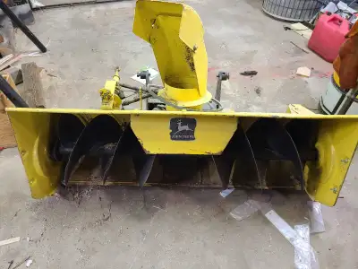 Stored indoors, good condition, ran last year, 42" snow blower c/w shute rod & bracket, was on a JD...