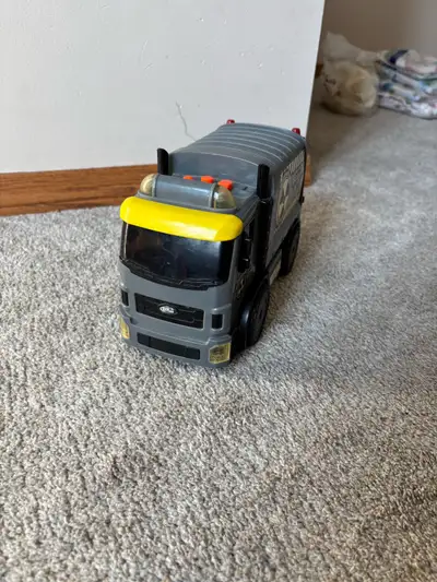 This is a used garbage truck toy that's ready for a new home. It's the perfect addition to any child...