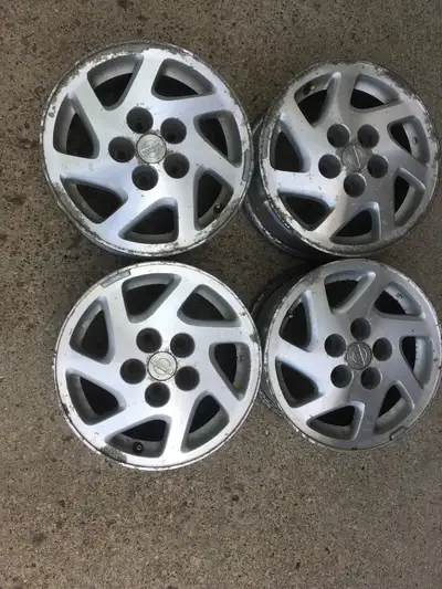 Four 15x6.5 Nissan (Altima etc) alloy rims. 5x114.5 bolt pattern. Rims are straight and in decent co...