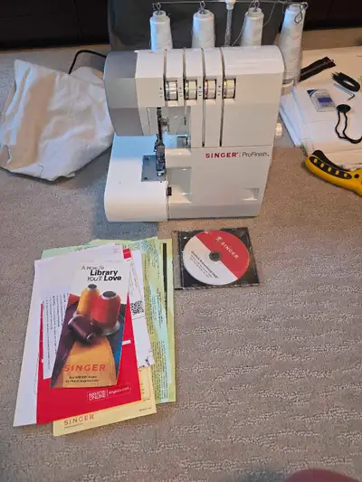 I'm selling a used Singer ProFinish serger sewing machine, a versatile tool designed to professional...