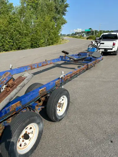 This is an older Road Boss brand trailer that will handle boats up to 30 feet long but not more than...