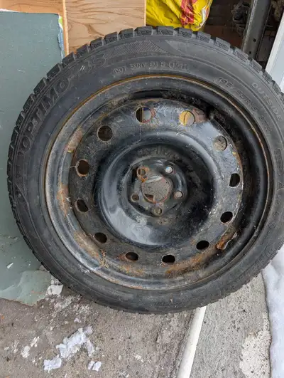 I'm selling a Hankook Optimo 195/65R15 winter tire mounted on a steel rim, perfect for providing rel...