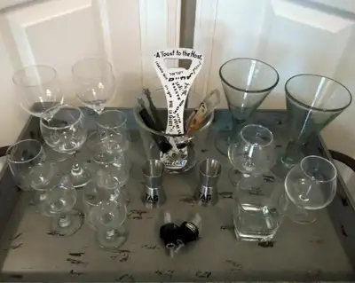 Barware in excellent condition including stemware, pour spouts, TAG stainless steel double jiggers,...