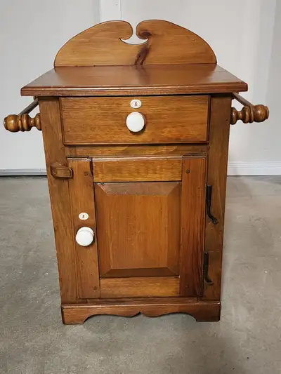 Solid pine wash stand constructed with an antique look. It was built by Marcelville Custom Cabinetry...