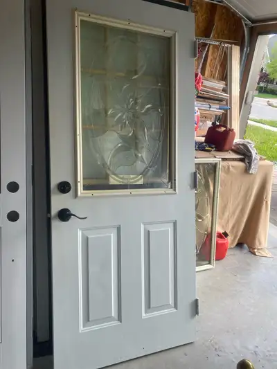 Exterior metal insulated door with elegant thermal stained glass insert 33.75”x79” good condition As...