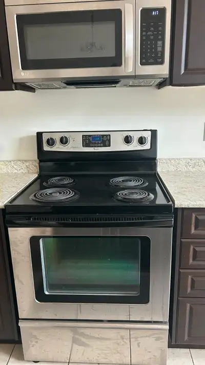 Both Whirlpool Refrigerator and 4 burner Electric oven together, View more