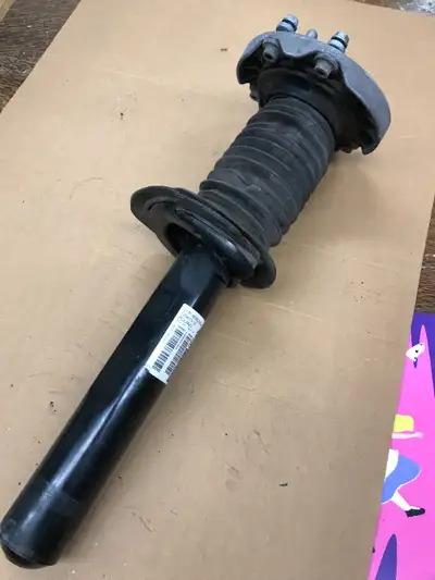 Front right (Passenger side) strut assembly minus the spring for a 2019 BMW X2 . According to link b...