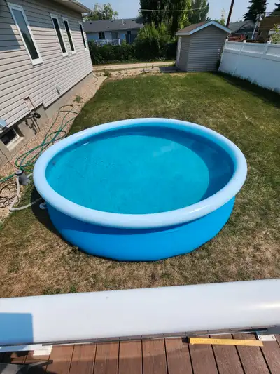 12 feet wide x approx 30 inches deep, inflatable ring leaks, comes with hoses and pump, filter not i...