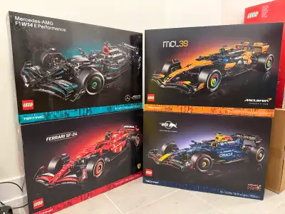 I am selling a collection of four brand new, factory-sealed LEGO Technic Formula 1 racing car sets....