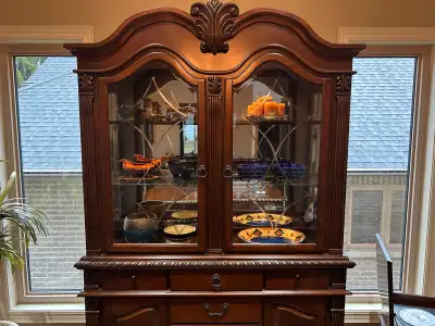 Solid Wood China / Display Cabinet in Dark Brown. Amazing ornate detailing. This is from Ashley’s st...