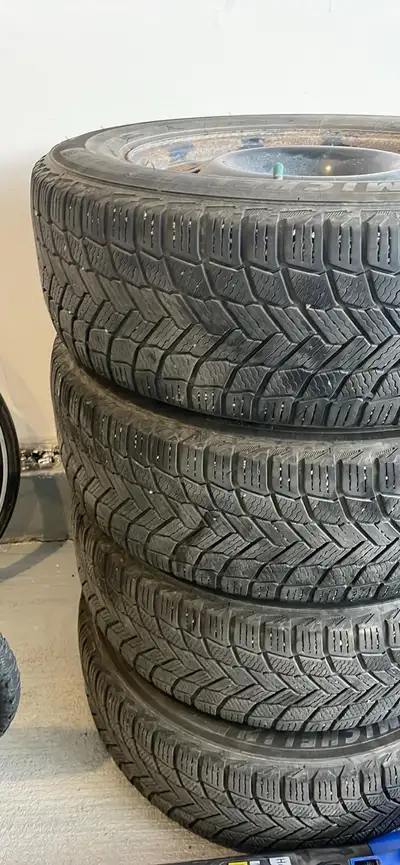 Selling a set of 4 Michelin winter tires mounted on steel rims. Details: * Brand: Michelin * Size: 2...