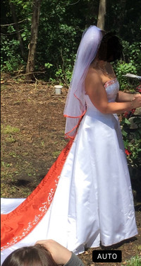 Beautiful detailed wedding dress with hook for the long train