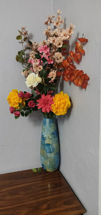 Multiple flowers in marble glass vase