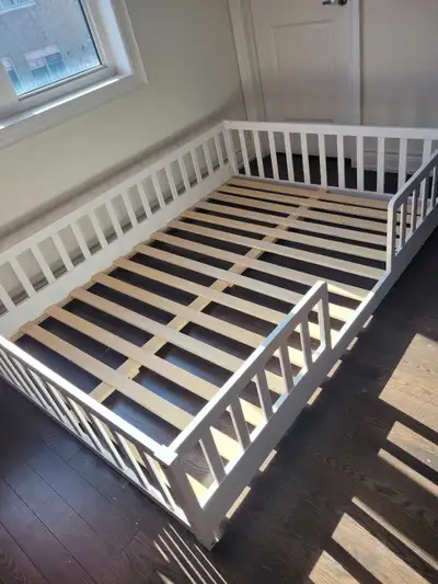 This white toddler bed frame provides a secure and stylish sleeping space for your little one, desig...