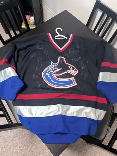 Canucks jersey signed by team, View more