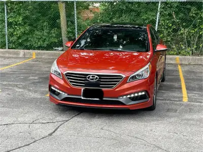Stand out with this well-maintained 2015 Hyundai Sonata 2.0T Turbo in a rare orange finish with spor...