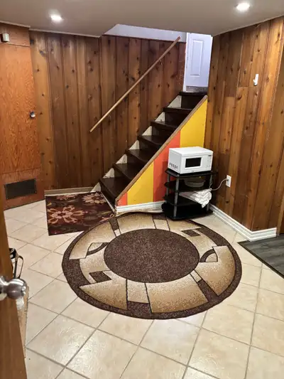 Furnished private room in the basement sharing kitchen and bathroom with 2 person live in the other...