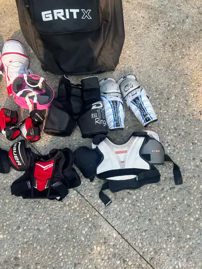 Includes hockey bag, jr pink helmet, kids small elbow pads, skates size 2, shoulder pads size youth...