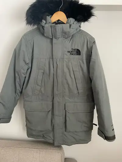 Kids North Face McMurdo Parka for sale. In great condition, a few minor tears. Please see detailed p...