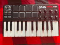 Akai mpk mini MK1 keyboard and drum machine.