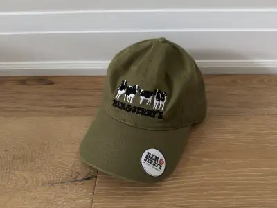 This snazzy, new Ben & Jerry's green hat features the iconic cows and logo, perfect for showing off...