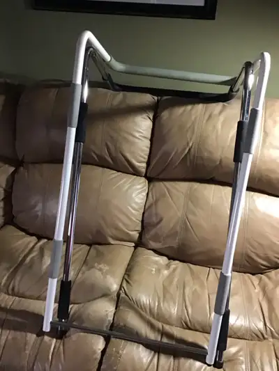 A pair of safety rails for seniors or patients recovering at home. Restricts from rolling off the be...