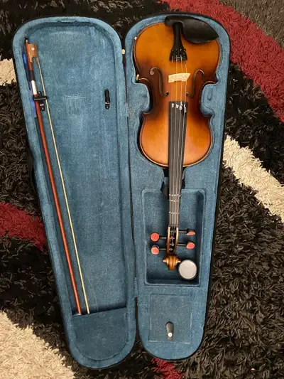 I only used it once . It is in perfect condition and comes with a case, bow, shoulder rest, and stri...
