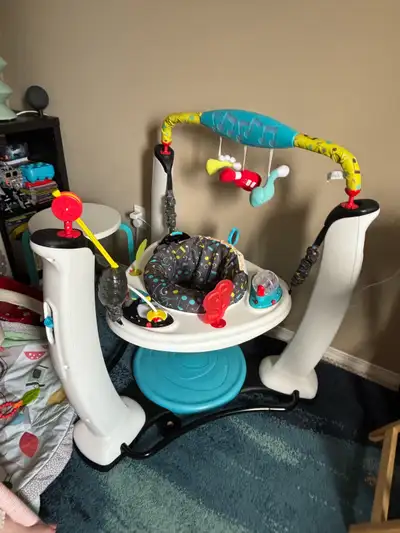 This Evenflo ExerSaucer is a great way to keep your little one entertained and active! It features a...