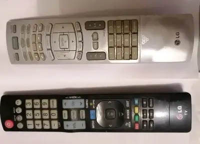 LG TV DVD VCR AUDIO REMOTES, BLACK ONE IS TV REMOTE, SILVER ONE IS TV/DVD/VCR AUDIO REMOTE, ALL WORK...