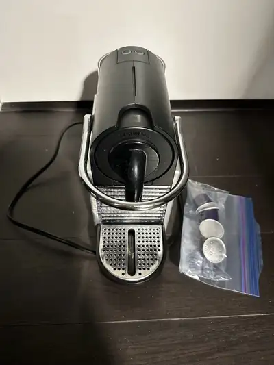 I'm selling a used Nespresso Essenza Mini coffee machine that's ready to brew some delightful espres...