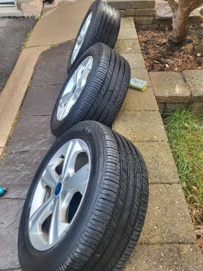 I am selling a set of five 2015 OEM Ford Escape rims and tires, size 5x108, tire size 235 55 17 99H...