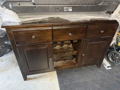 This brown buffet is was from Leon’s and we just had it wrapped up for a few year cause we didn’t ha...