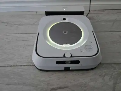 Smart iRobot Braava jet m6 robot mop. Comes with its charging dock. Great for keeping hard floors cl...