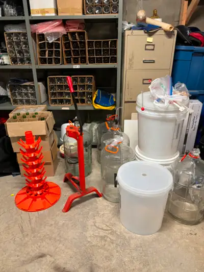 Selling vine making supplies. Corker, buckets, tubing, drying rack, carboys, and lots of bottles.