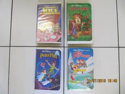 Up for sale is a four piece vintage lot of Walt Disneys Black Diamond Classic VHS animated movies: T...