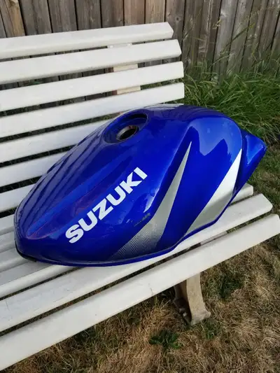 This is a Suzuki blue gas tank. It is in used condition and has some cosmetic imperfections. Based o...